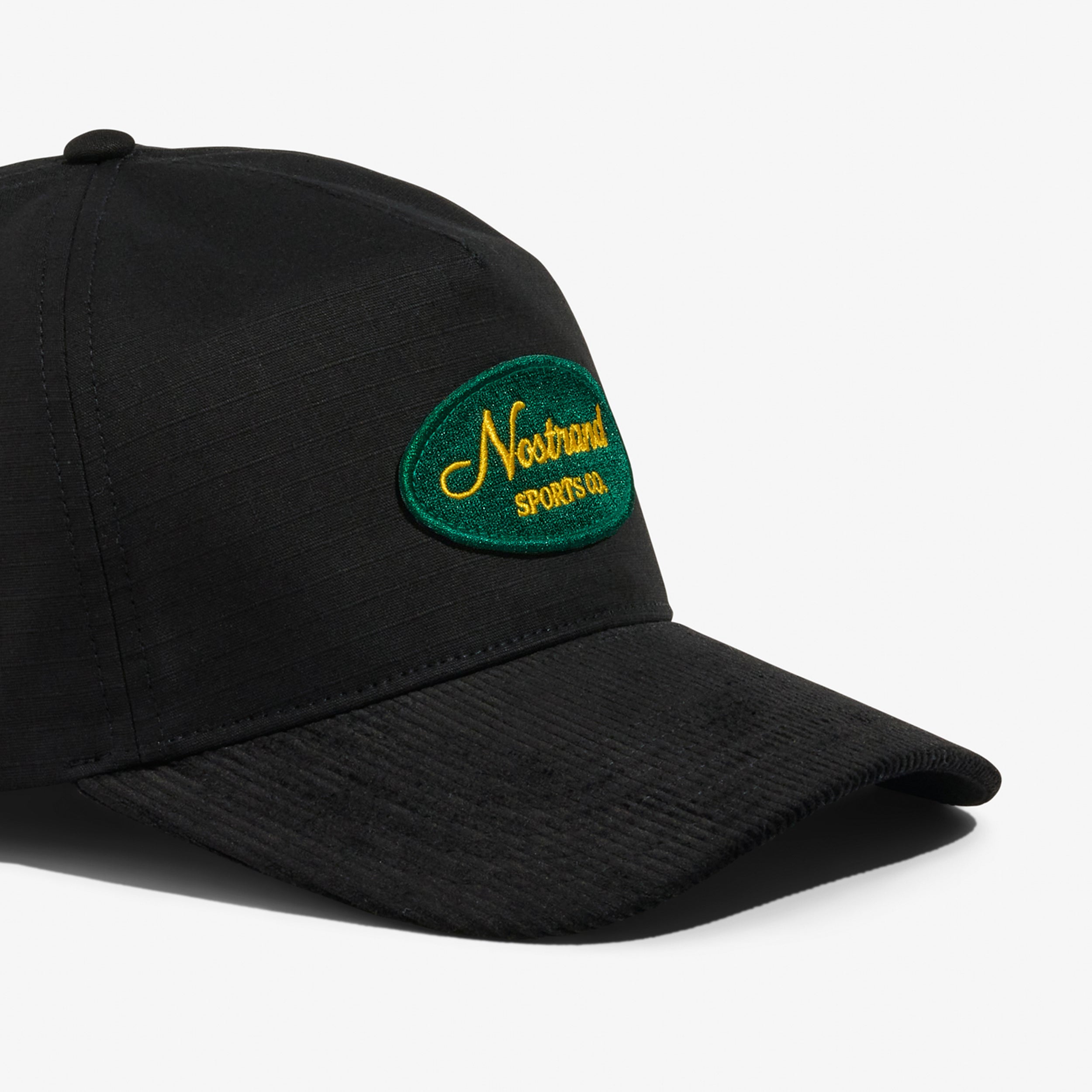 Black Cotton and Black Corduroy Brim Hat with a Embroidered Script Logo on a white background