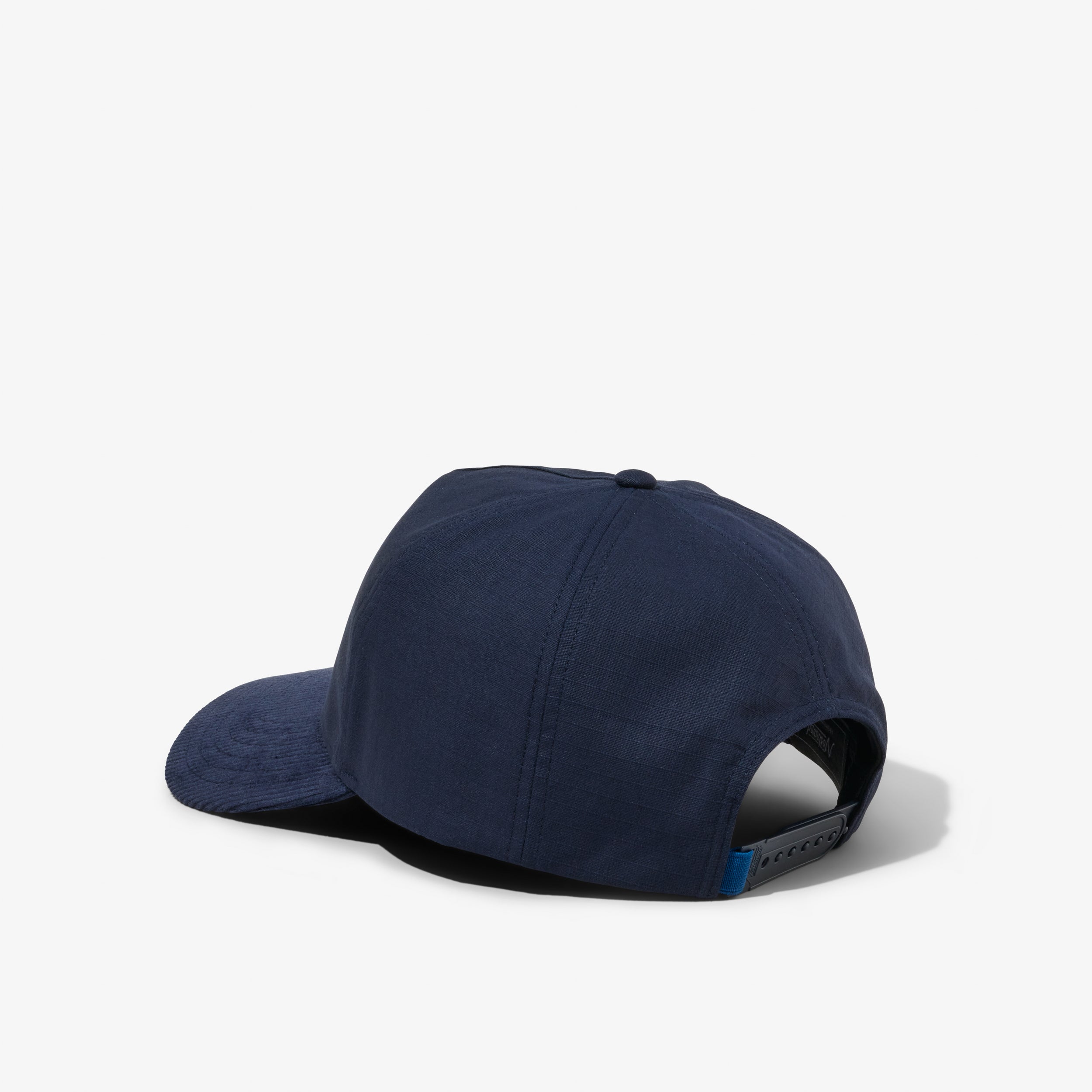 Navy Blue Cotton and Navy Blue Corduroy Brim Hat with a Embroidered Script Logo on a white background