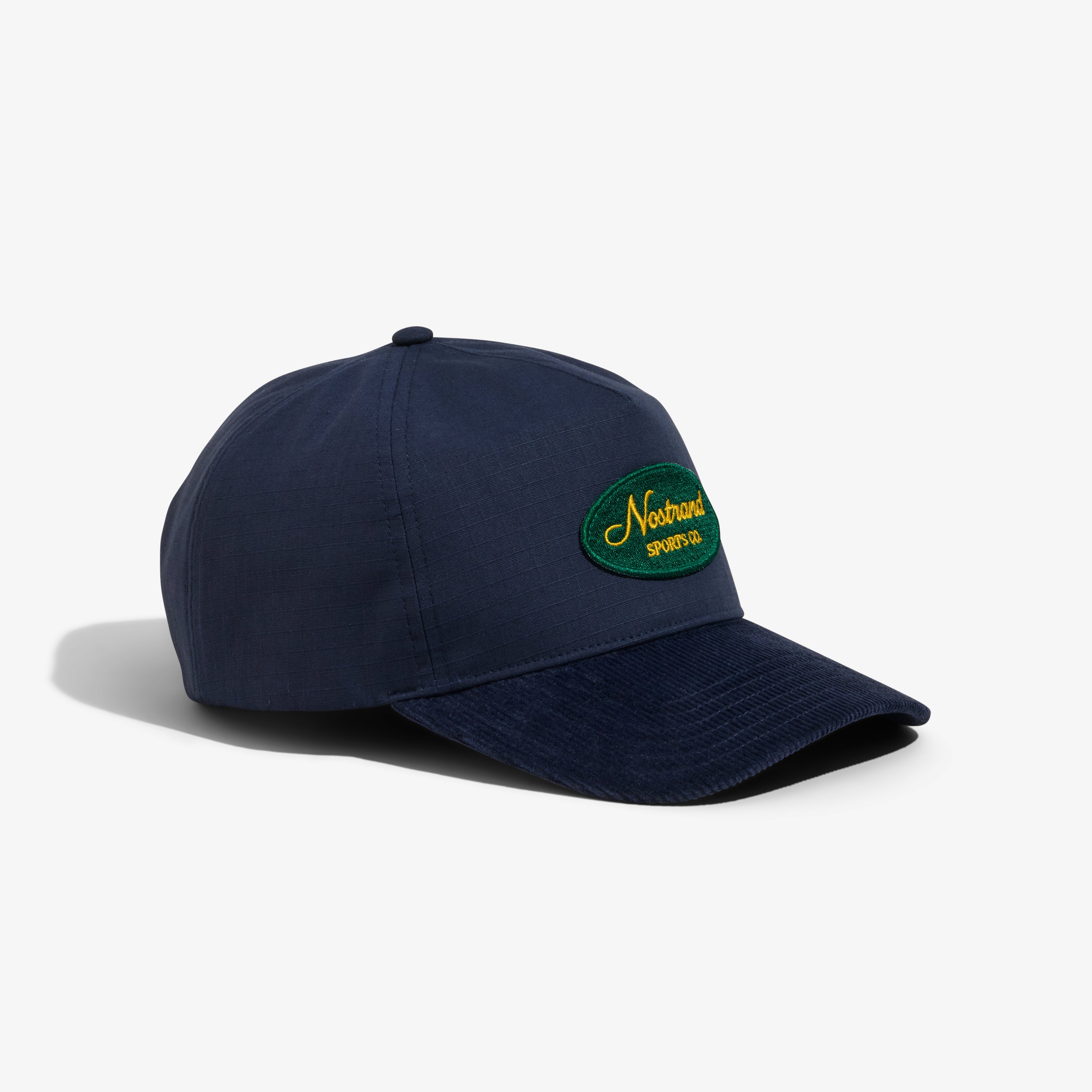 Navy Blue Cotton and Navy Blue Corduroy Brim Hat with a Embroidered Script Logo on a white background