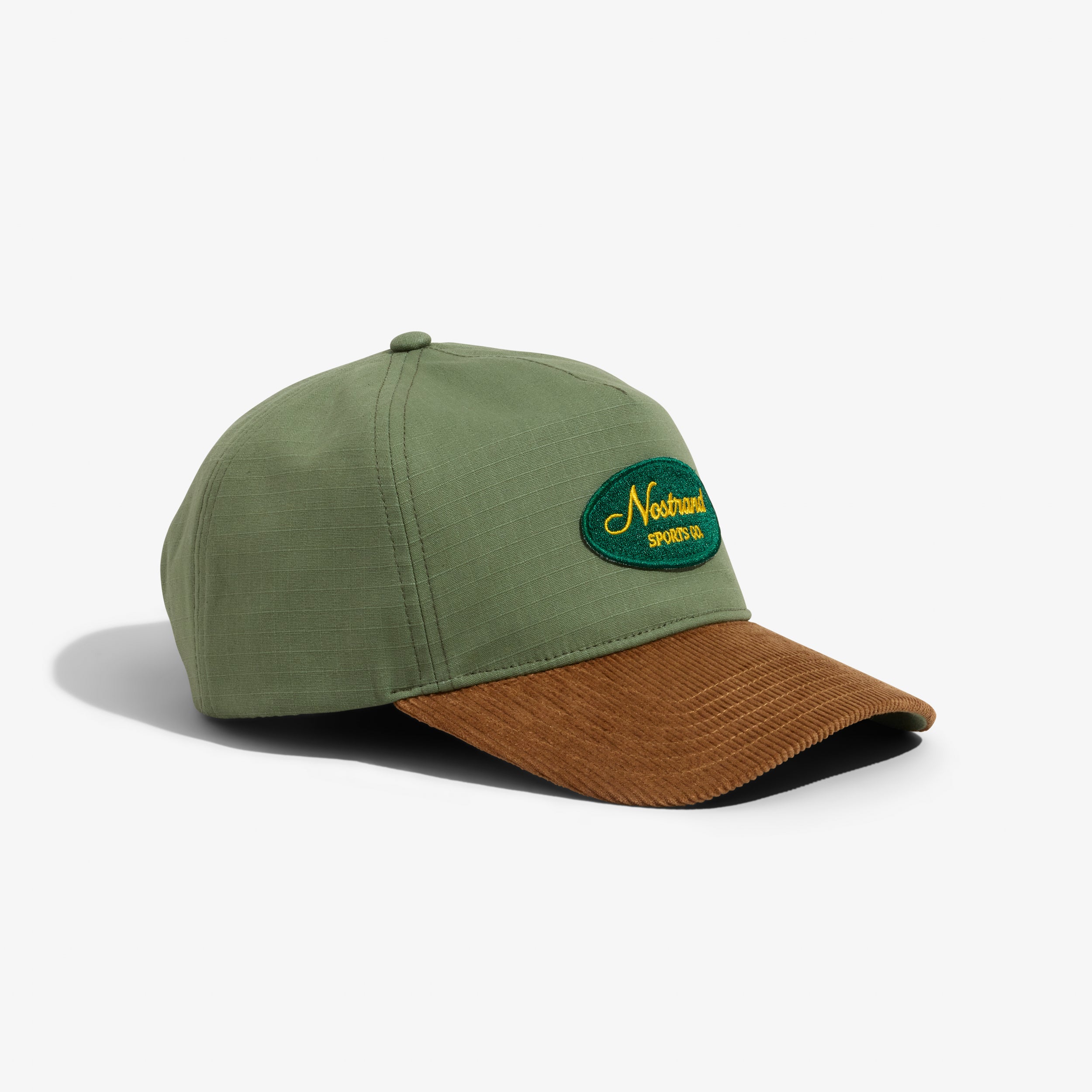 Olive Green Cotton and Tan Corduroy Brim Hat with a Embroidered Script Logo on a white background